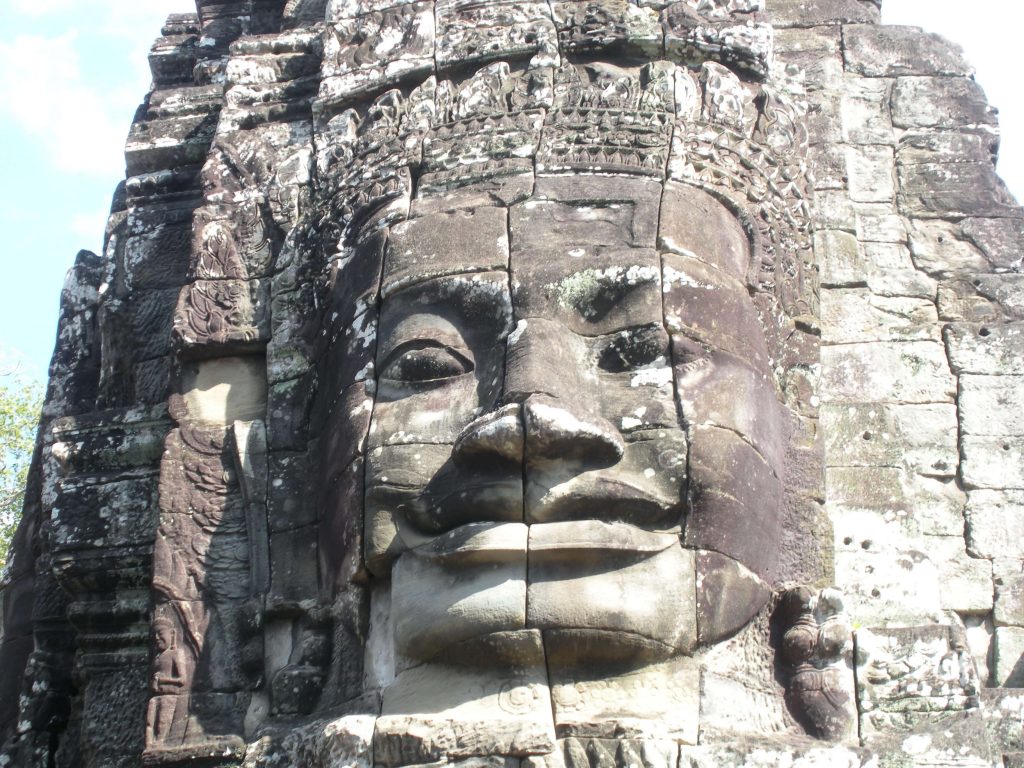 Frontal of a massive head carving. 