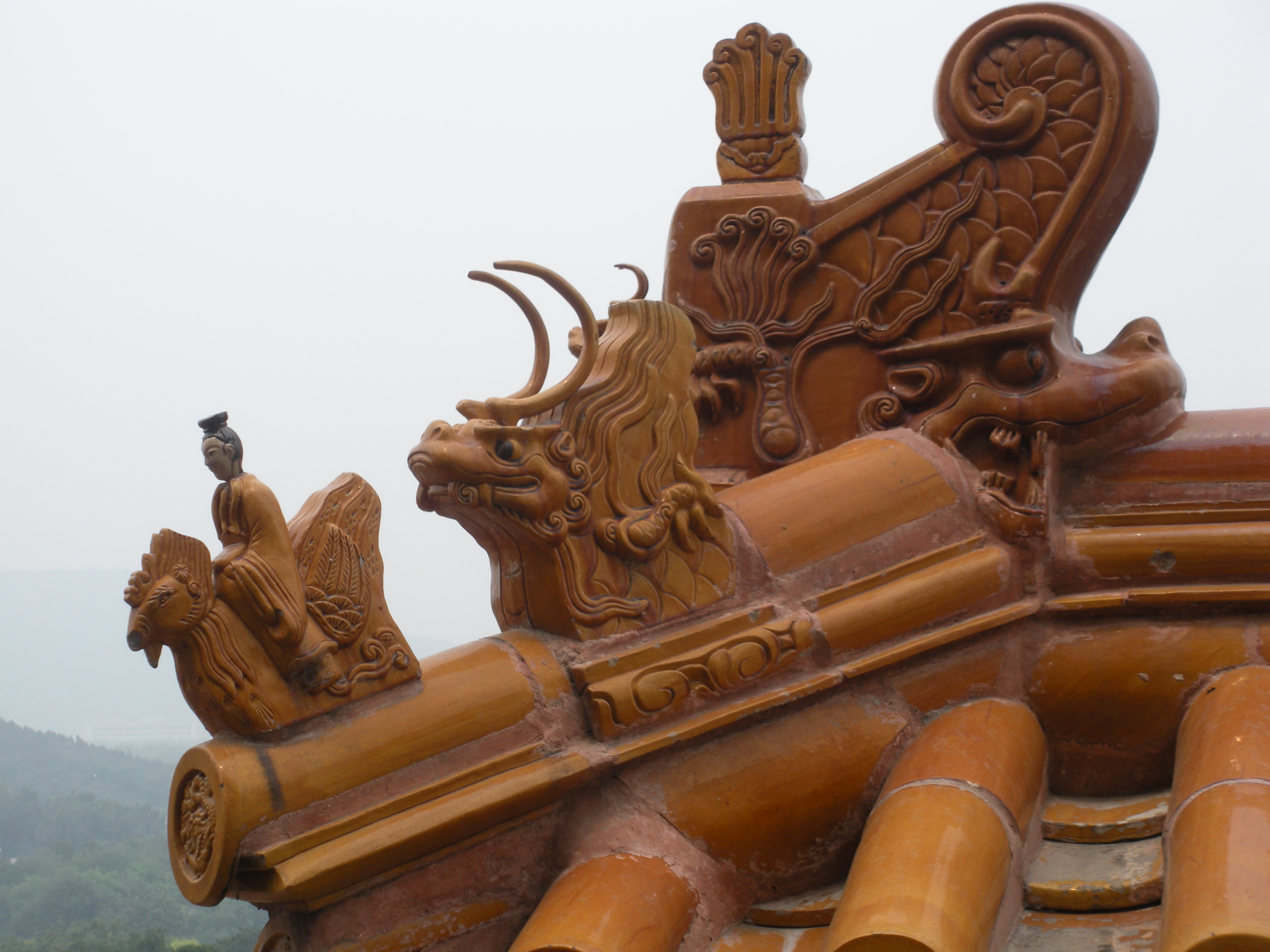 Glazed, yellow, figurines top Imperial rooftops in Beijing