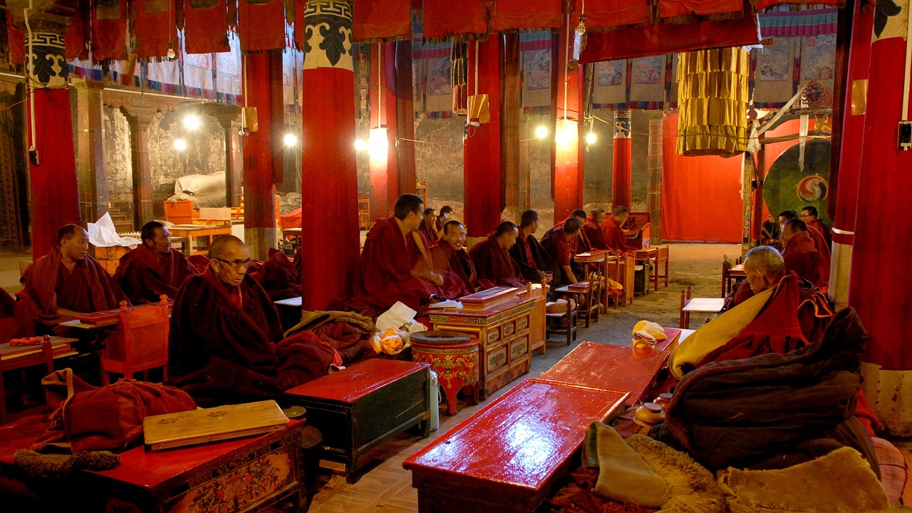 Tibetan monks at prayer in Potala Palace in Lhasa, Tibet