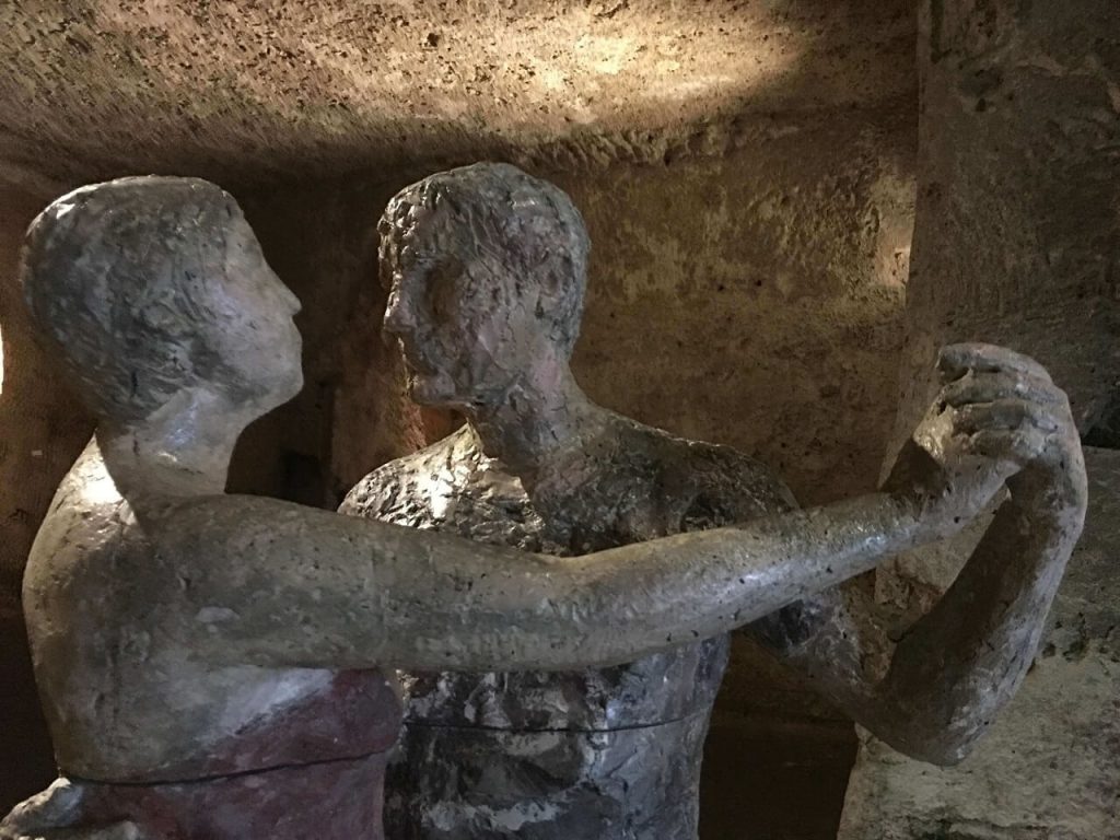Underground tango dancers in Matera Italy caves museum