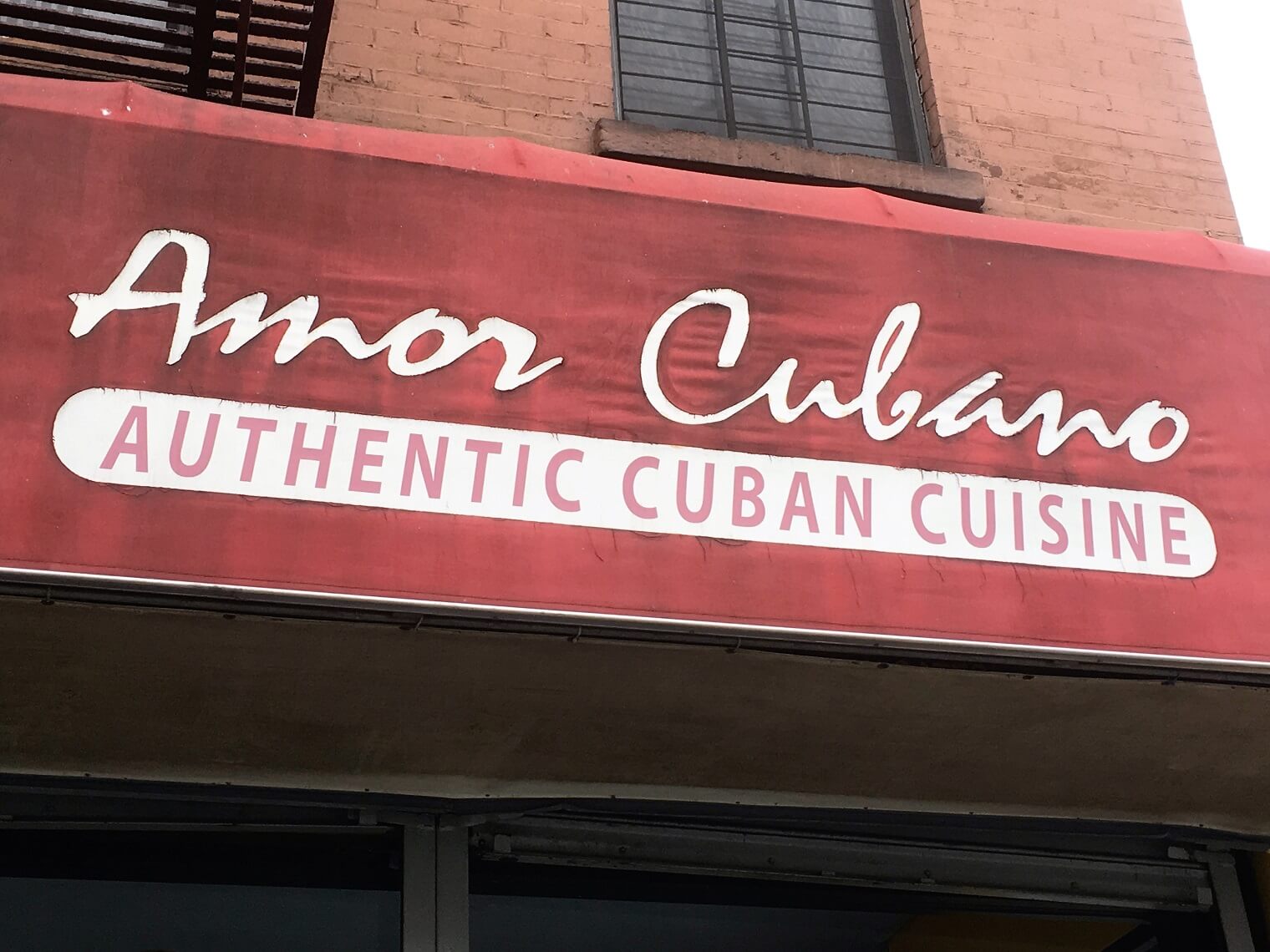 A sign reading Authentic Cuban cuisine. Cuban restaurants in NYC