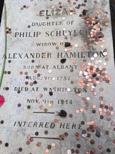 coins on one of the most famous graves in the United States.