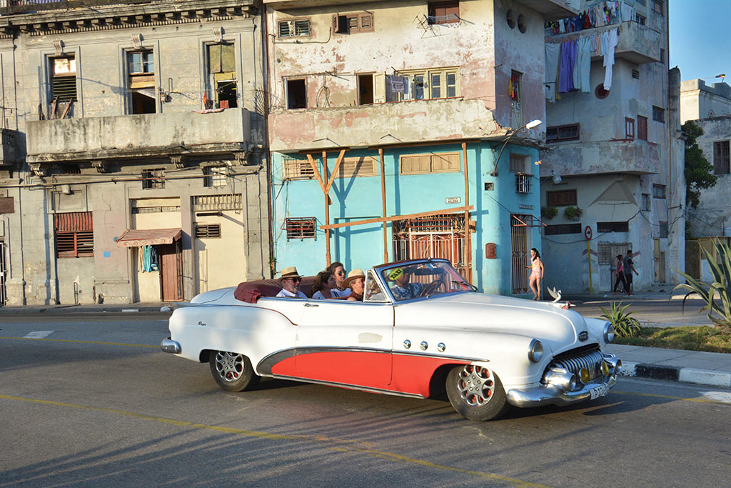 Riding classic cars in Havana