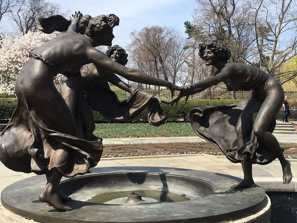 dancing women at the Conservatory Gardens, one of the underrrated places in NYC