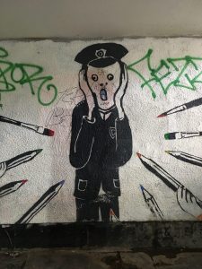 Tbilisi street art man with guns