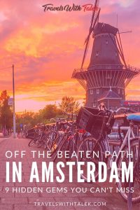 A Street in Amsterdam with bikes and a windmill