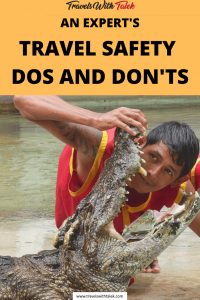 safety travel dos and don'ts, a man putting his head into an aligator's mouth