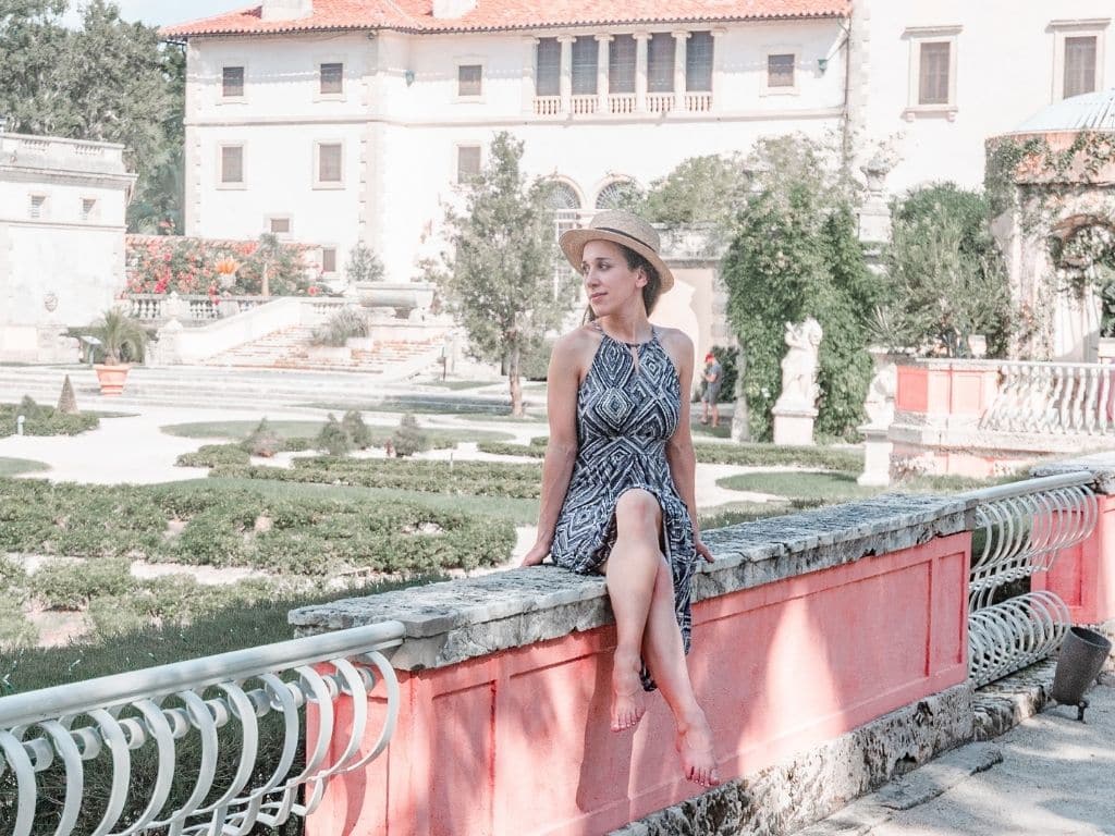 woman in front of Vizcaya Gardens, best things to do in Miami