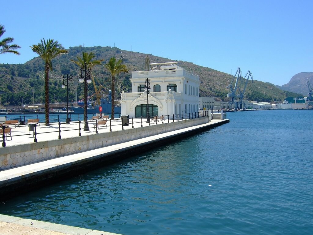 White building on dock in the port of Cartagena.