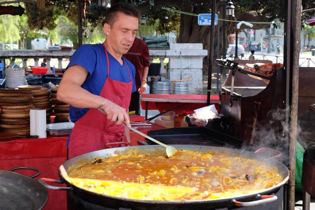 Preparing a paella, the regional cuisine of Spain par excellence 