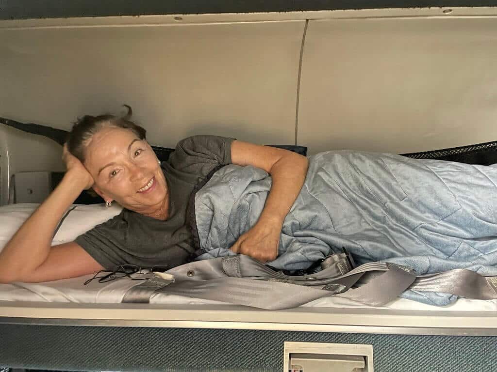 woman on a bunk bed on the Amtrak auto train