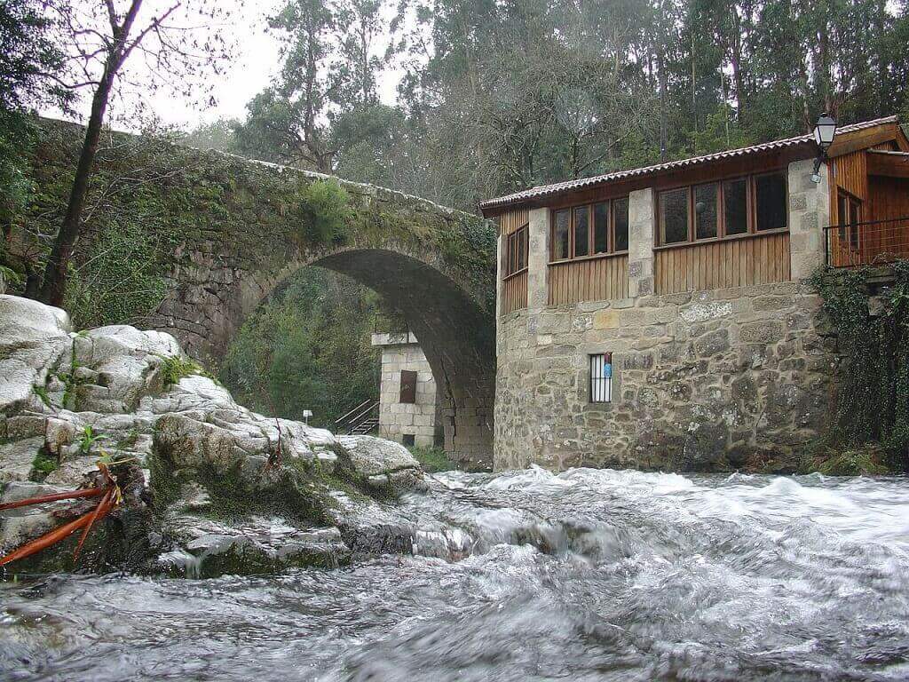 A stone house by a river