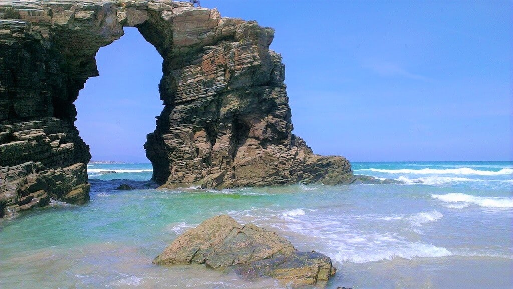 Soaring arches of Cathedral Beach, a lovely stop on your northern Spain road trip