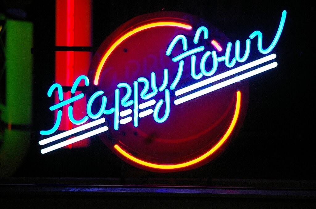 A Happy Hour neon sign