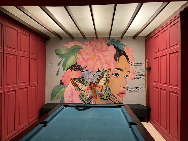 Billiard room with wall painting