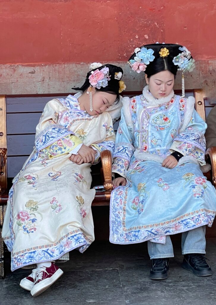 two sleeping girls in costume.