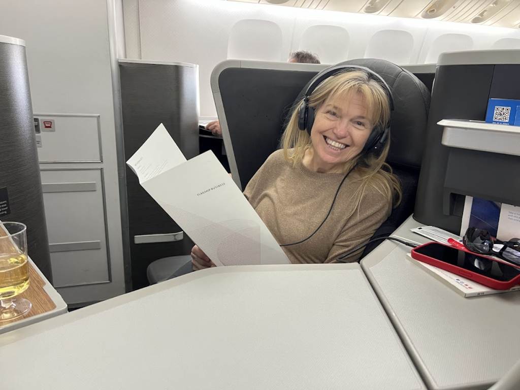 Happy passenger on business because she booked international airfares wisely.