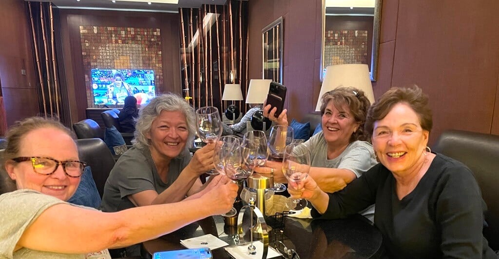 Women over 50 travelers drinking.