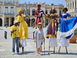 solo woman in plaza with performers