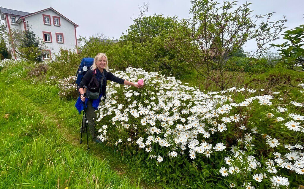 Woman with flowers on the Camino de Santiago