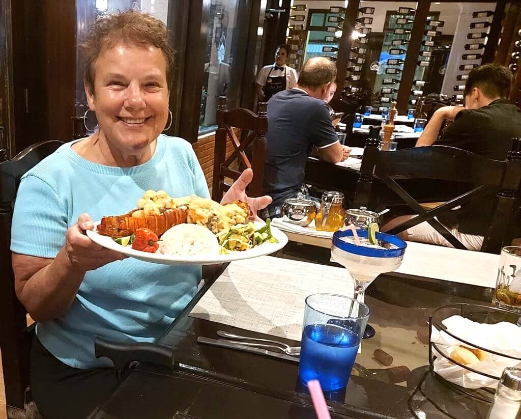 A woman with a seafood plate